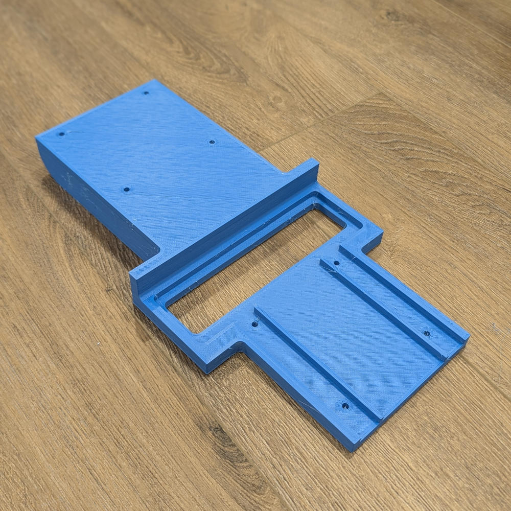 The adapter, printed in blue PLA